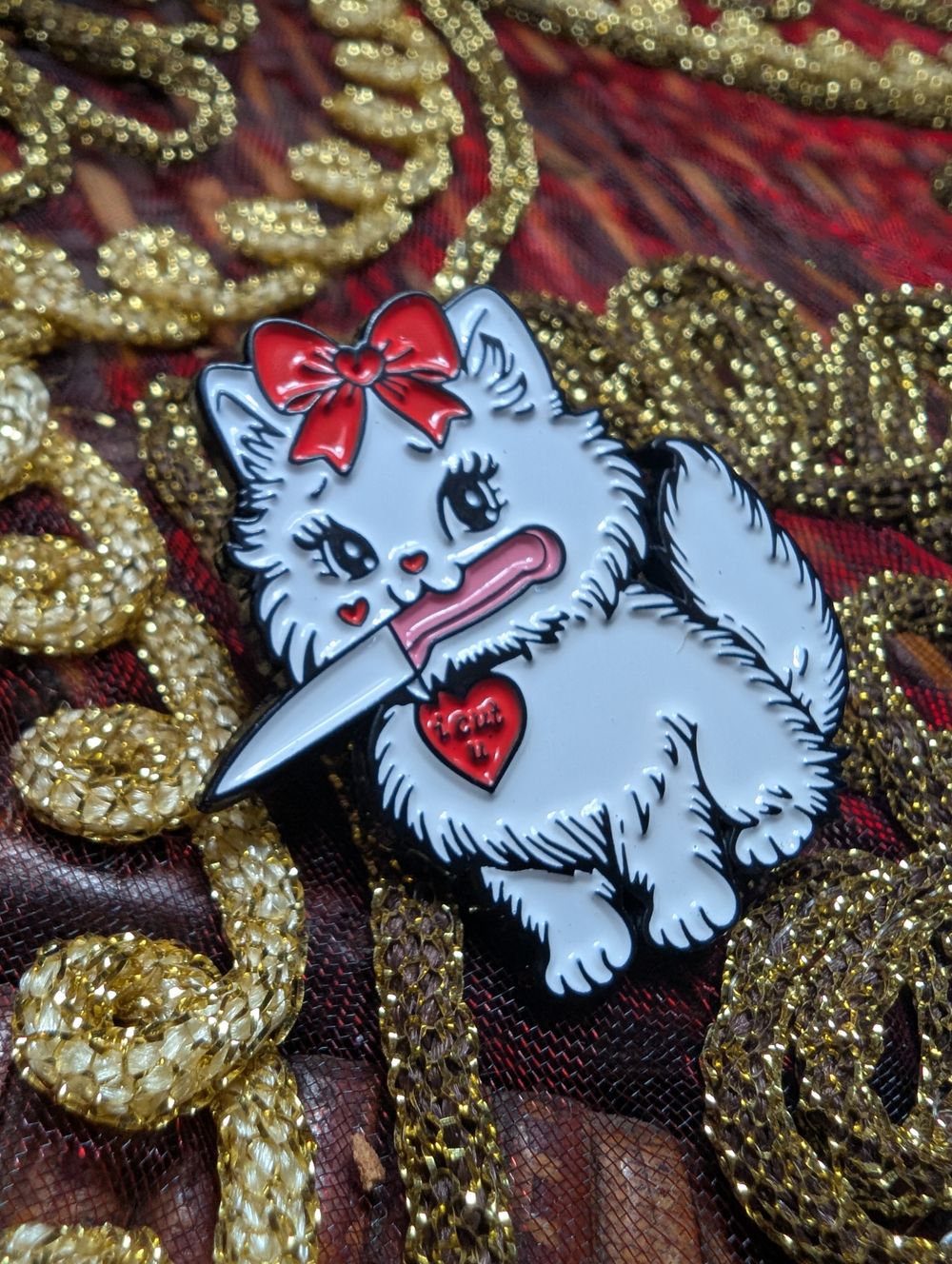 Kitty with a knife pin 